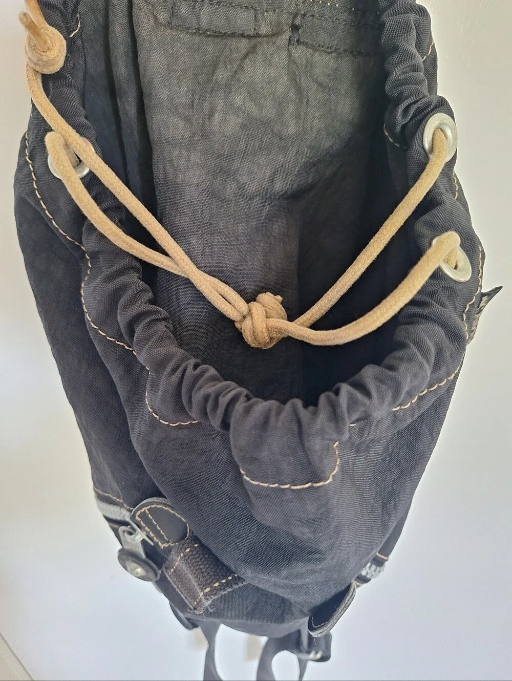 Kipling Black Canvas Drawstring Backpack with Handle And Front Zip Pockets